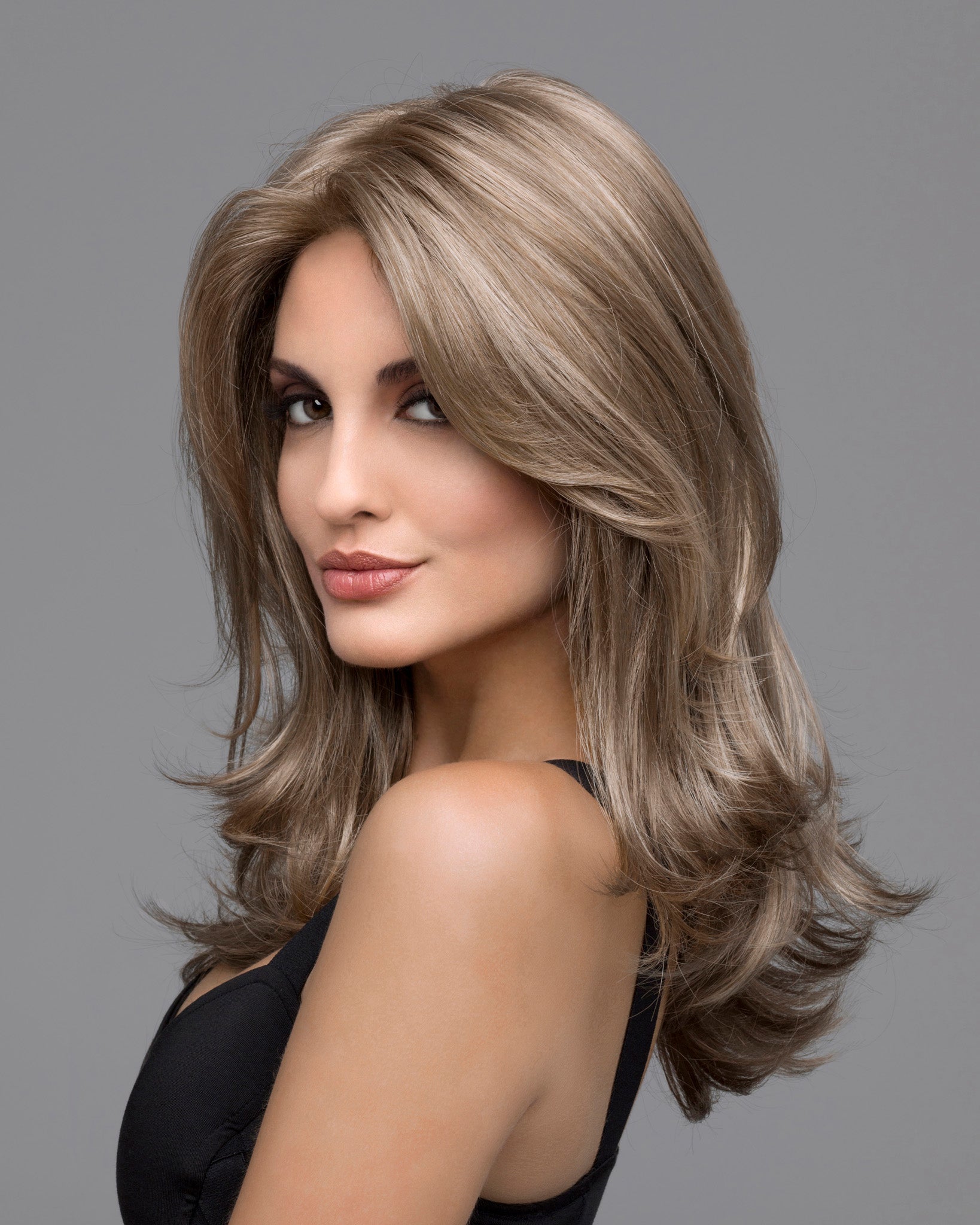 front and profile side of a long Kinner Beauty Wigs wig on woman head