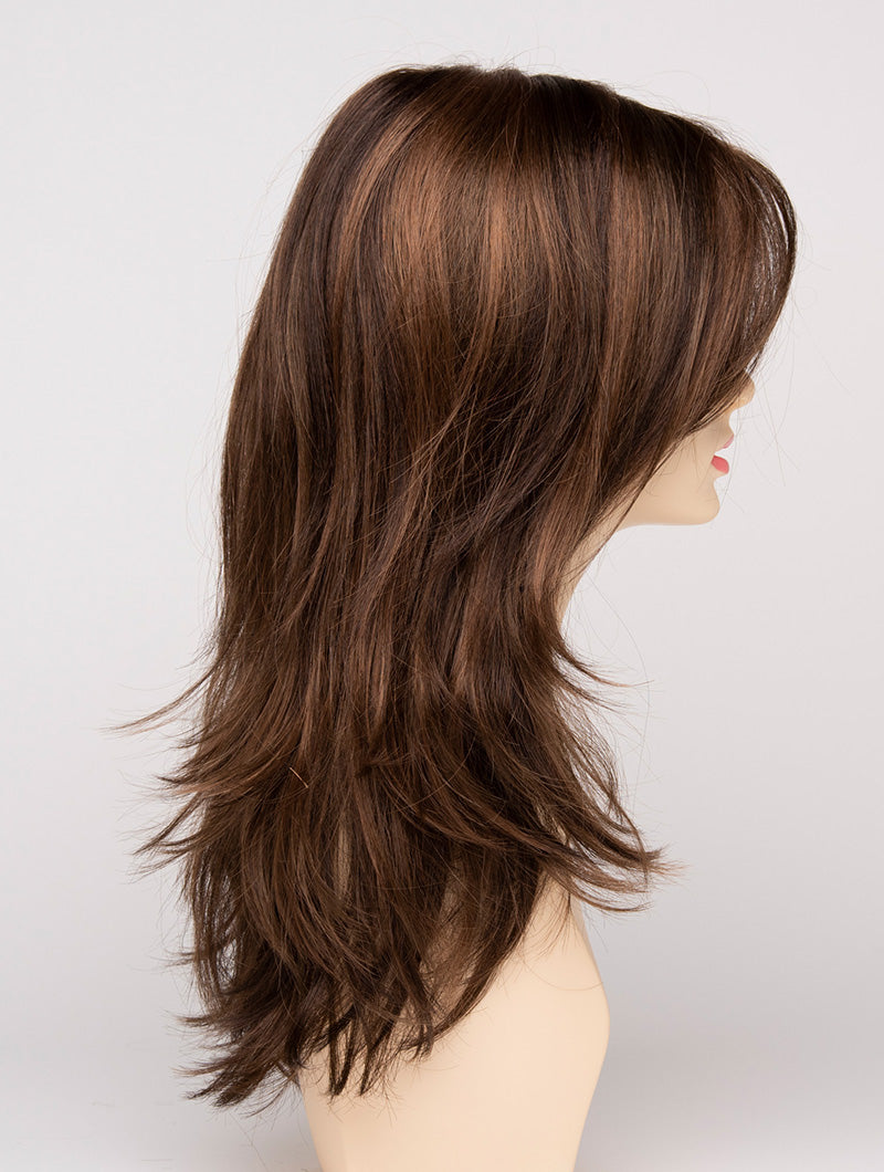 profile side of a long Kinner Beauty Wigs wig for woman on mannequin head