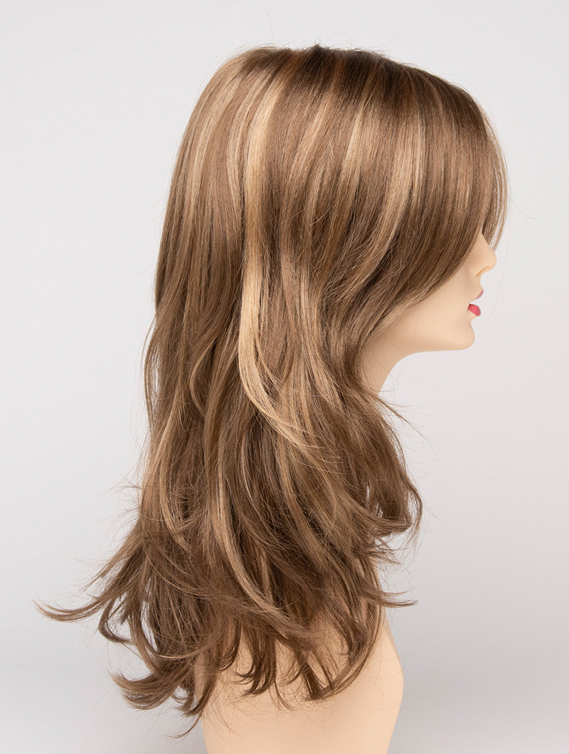 profile side of a long Kinner Beauty Wigs wig for woman on mannequin head
