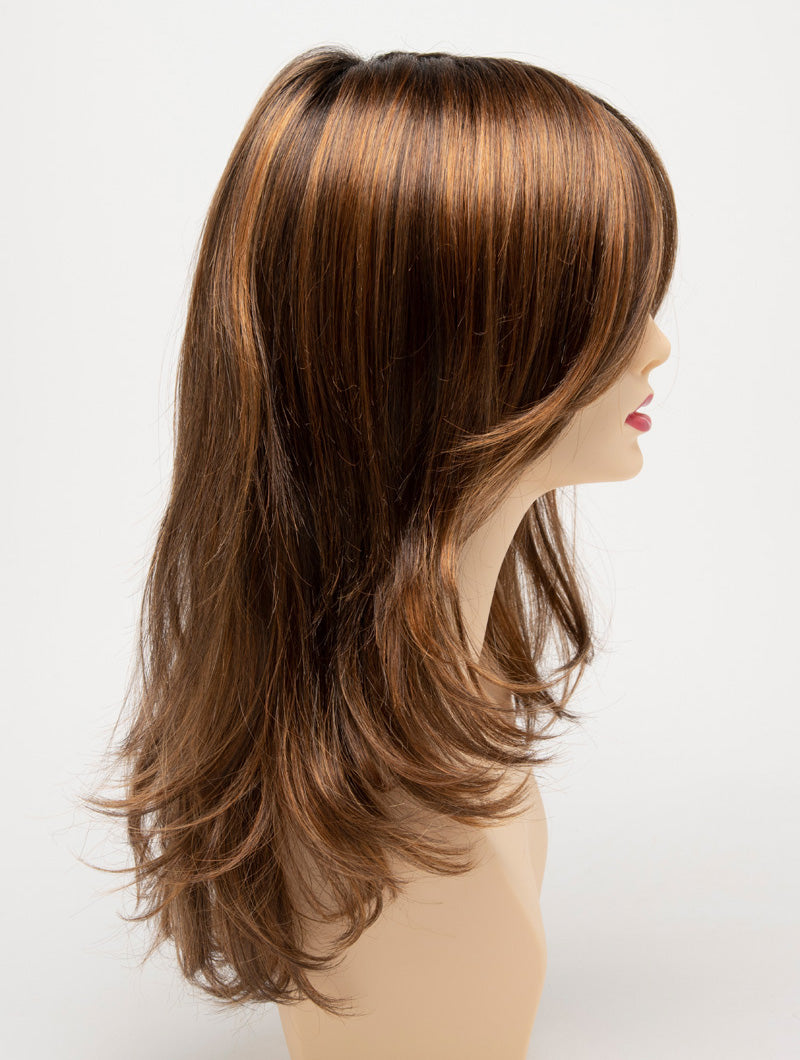 profile side of a long Kinner Beauty Wigs wig for woman on mannequin head