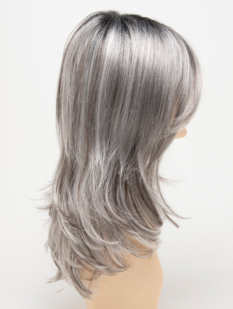 profile side of a long Kinner Beauty Wigs wig for woman on mannequin head