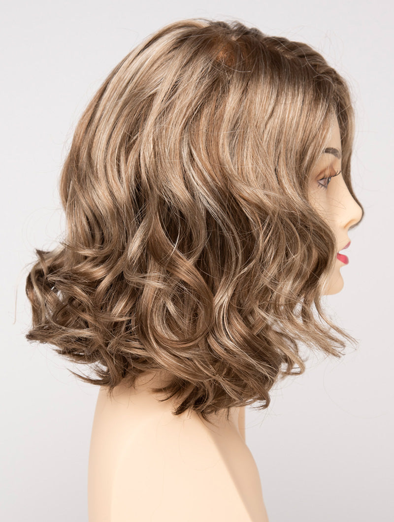 profile side of a medium Kinner Beauty Wigs wig for woman on mannequin head