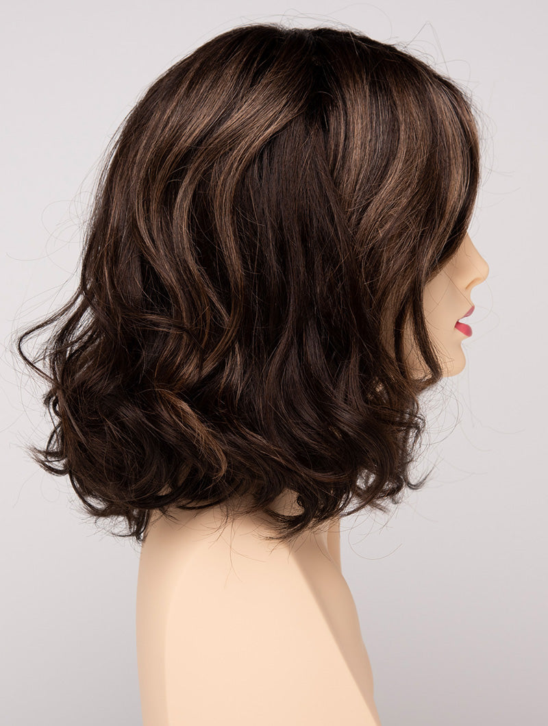 profile side of a medium Kinner Beauty Wigs wig for woman on mannequin head