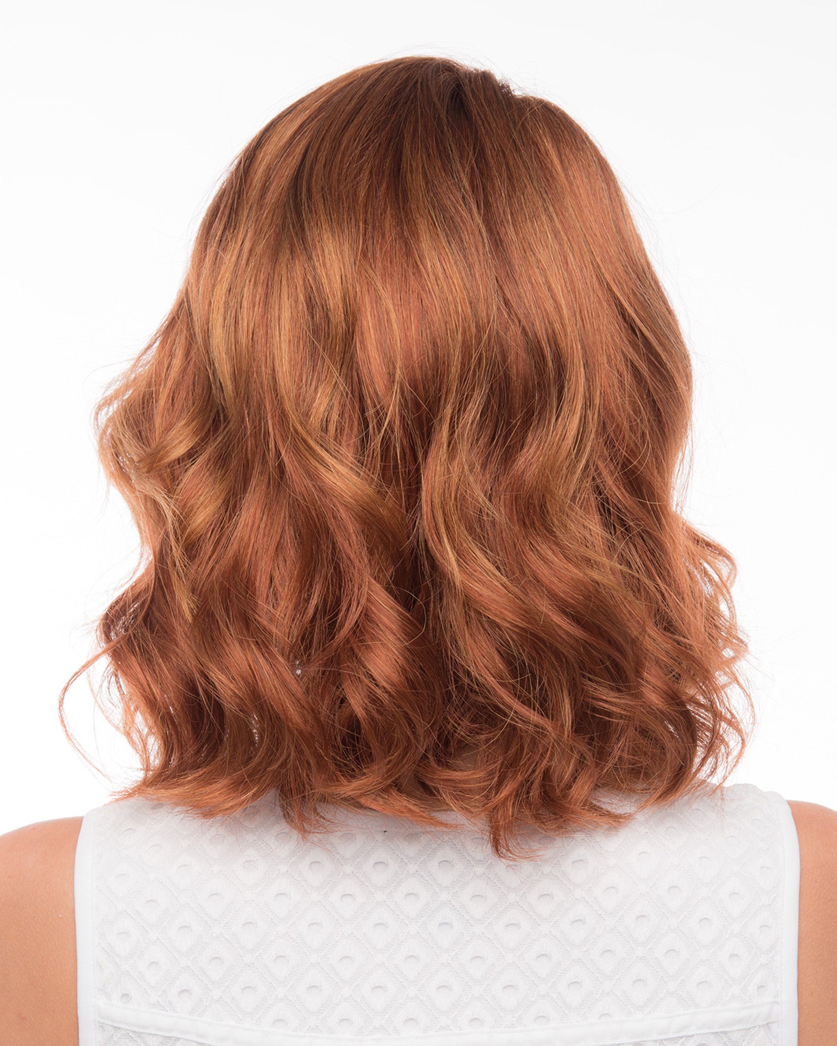 back side of a medium Kinner Beauty Wigs wig on woman head