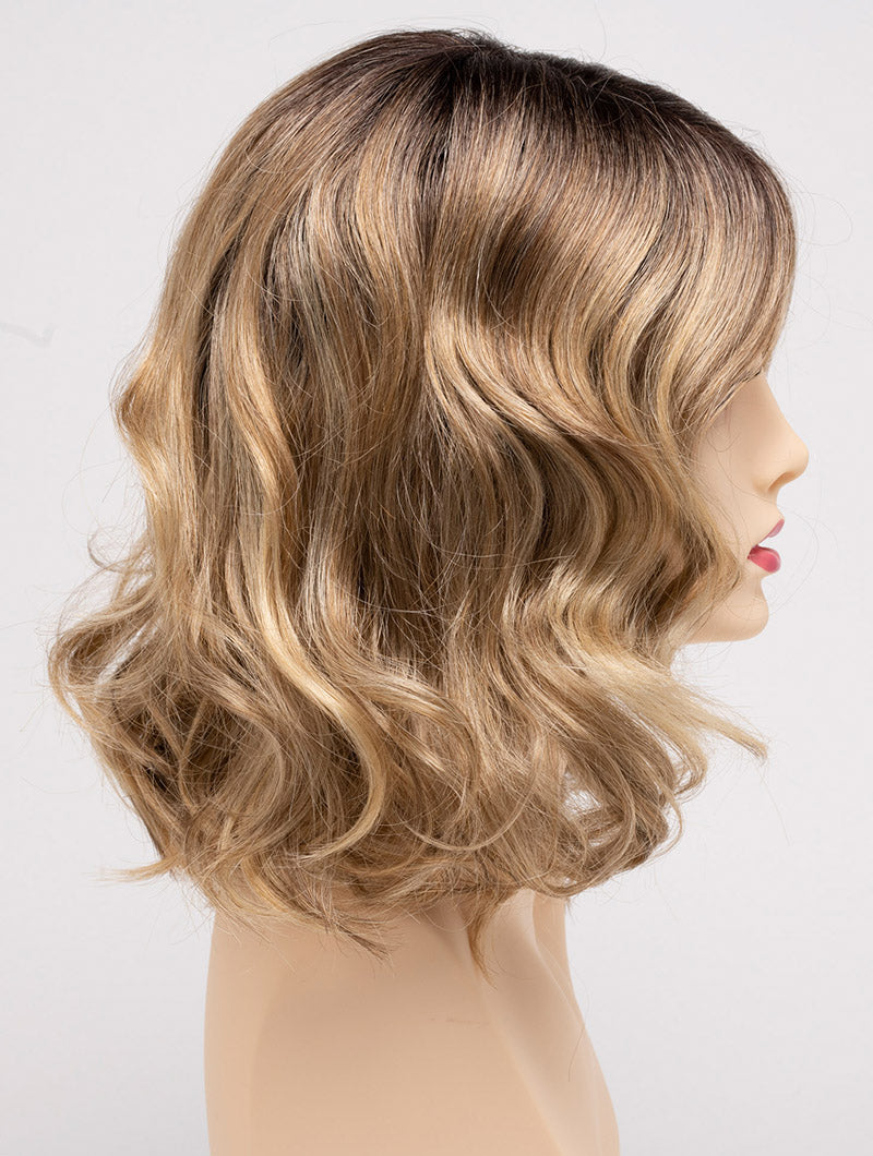 profile side of a medium Kinner Beauty Wigs wig for woman on mannequin head