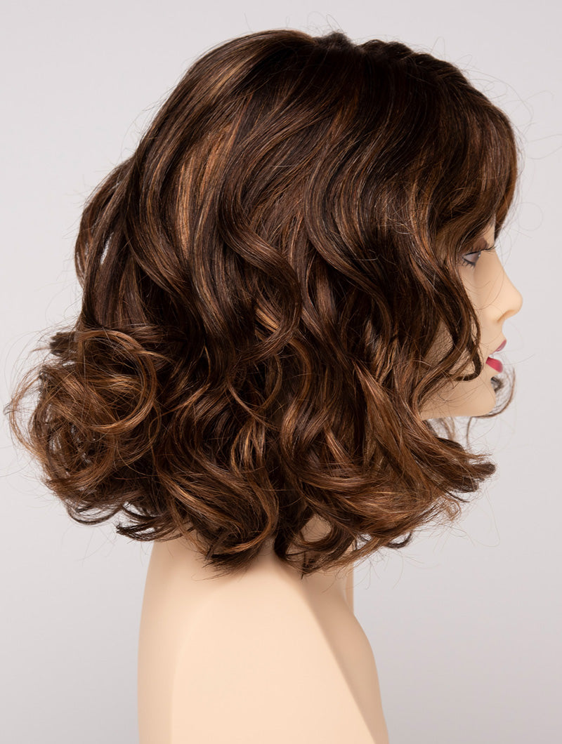 profile side of a medium Kinner Beauty Wigs wig for woman on mannequin head
