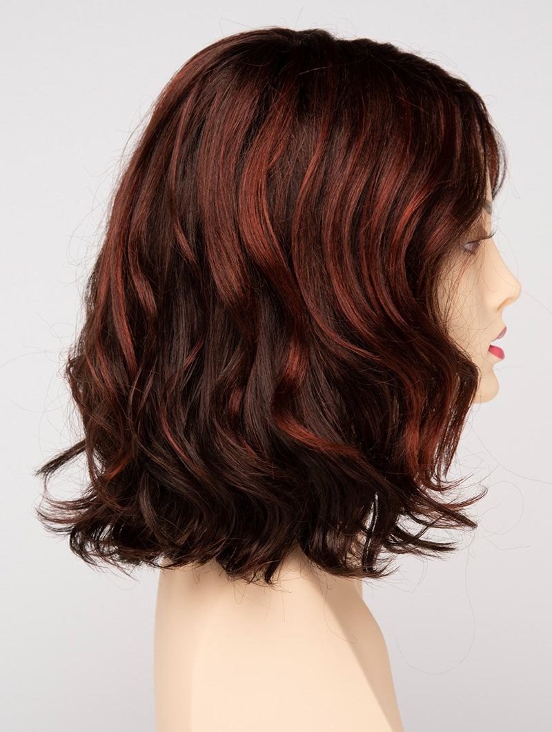 profile side of a medium Kinner Beauty Wigs wig for woman on mannequin head