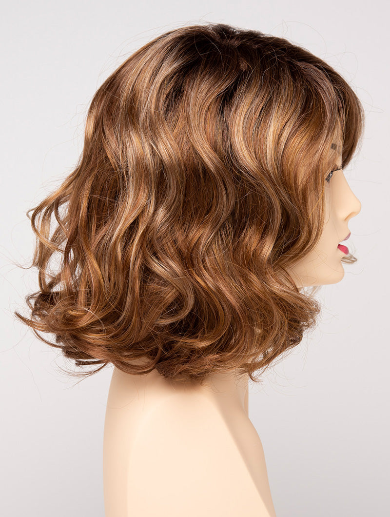 profile side of a medium Kinner Beauty Wigs wig for woman on mannequin head