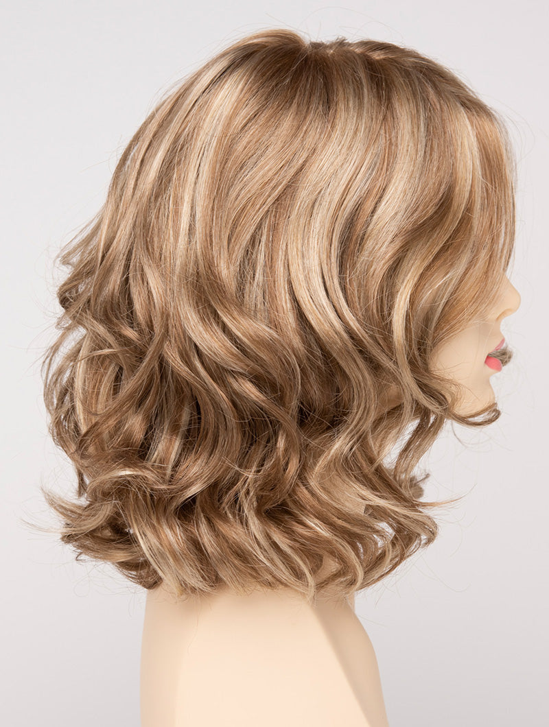 profile side of a medium Kinner Beauty Wigs wig for woman on mannequin head