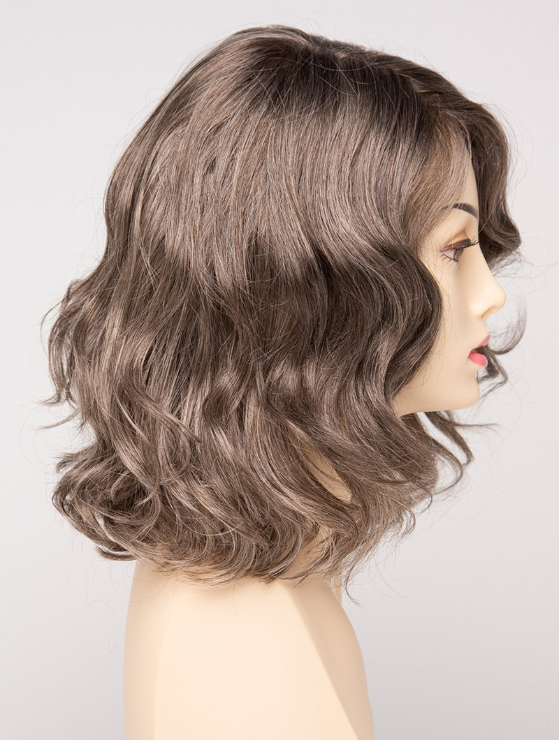 profile side of a medium Kinner Beauty Wigs wig for woman on mannequin head