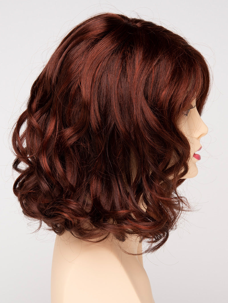 profile side of a medium Kinner Beauty Wigs wig for woman on mannequin head
