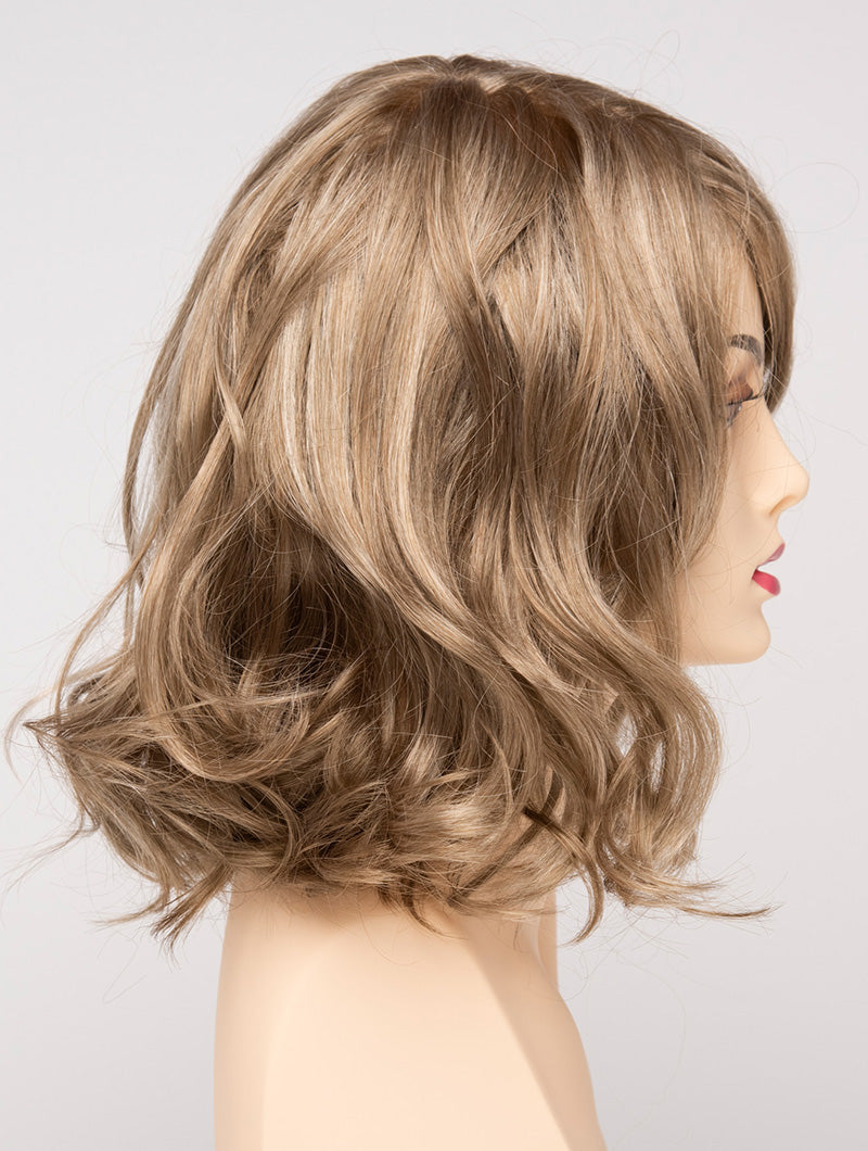profile side of a medium Kinner Beauty Wigs wig for woman on mannequin head