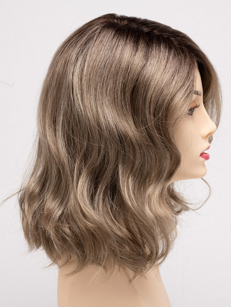 profile side of a medium Kinner Beauty Wigs wig for woman on mannequin head