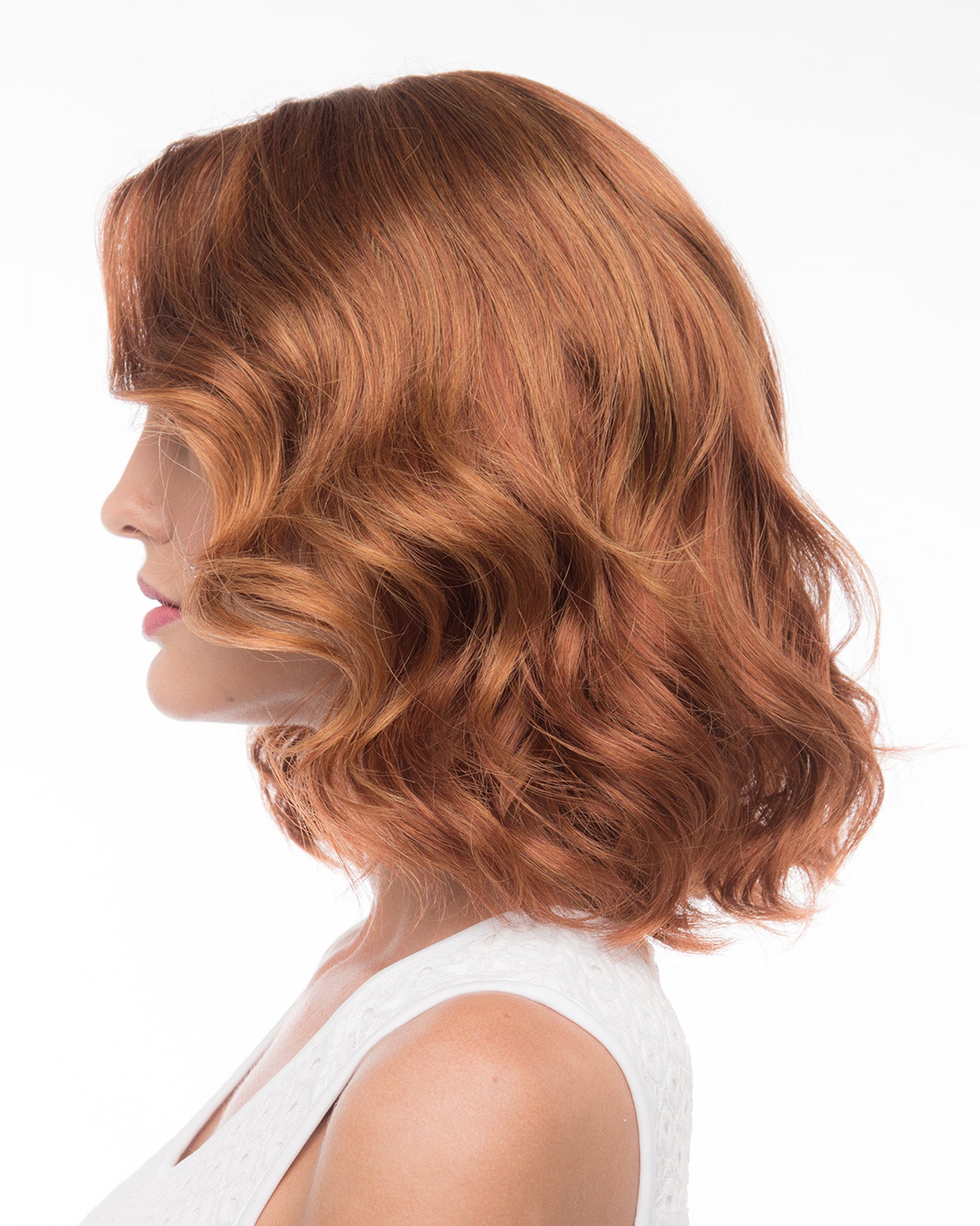 profile side of a medium Kinner Beauty Wigs wig on woman head