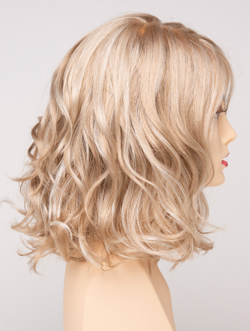 profile side of a medium Kinner Beauty Wigs wig for woman on mannequin head