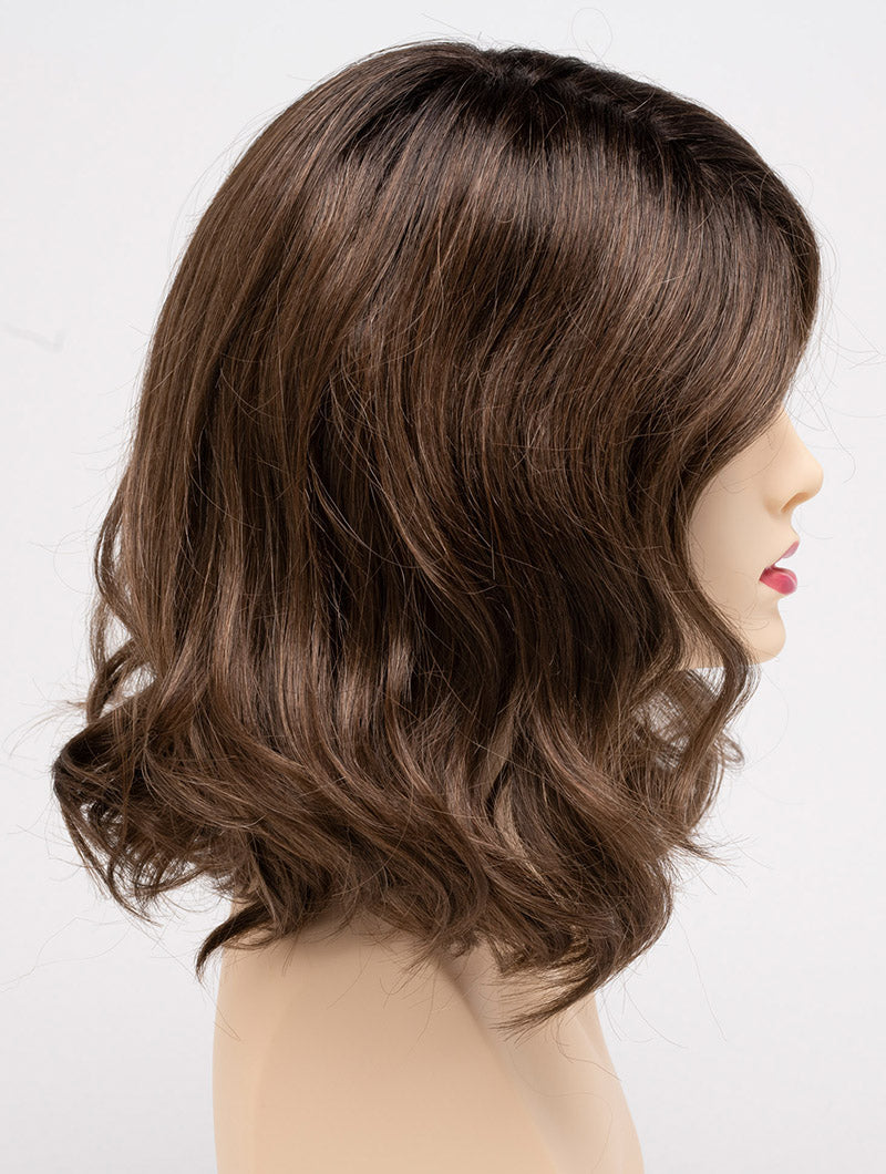 profile side of a medium Kinner Beauty Wigs wig for woman on mannequin head