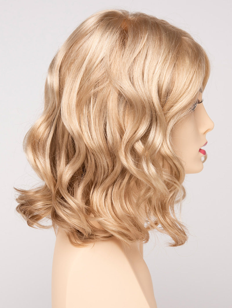 profile side of a medium Kinner Beauty Wigs wig for woman on mannequin head