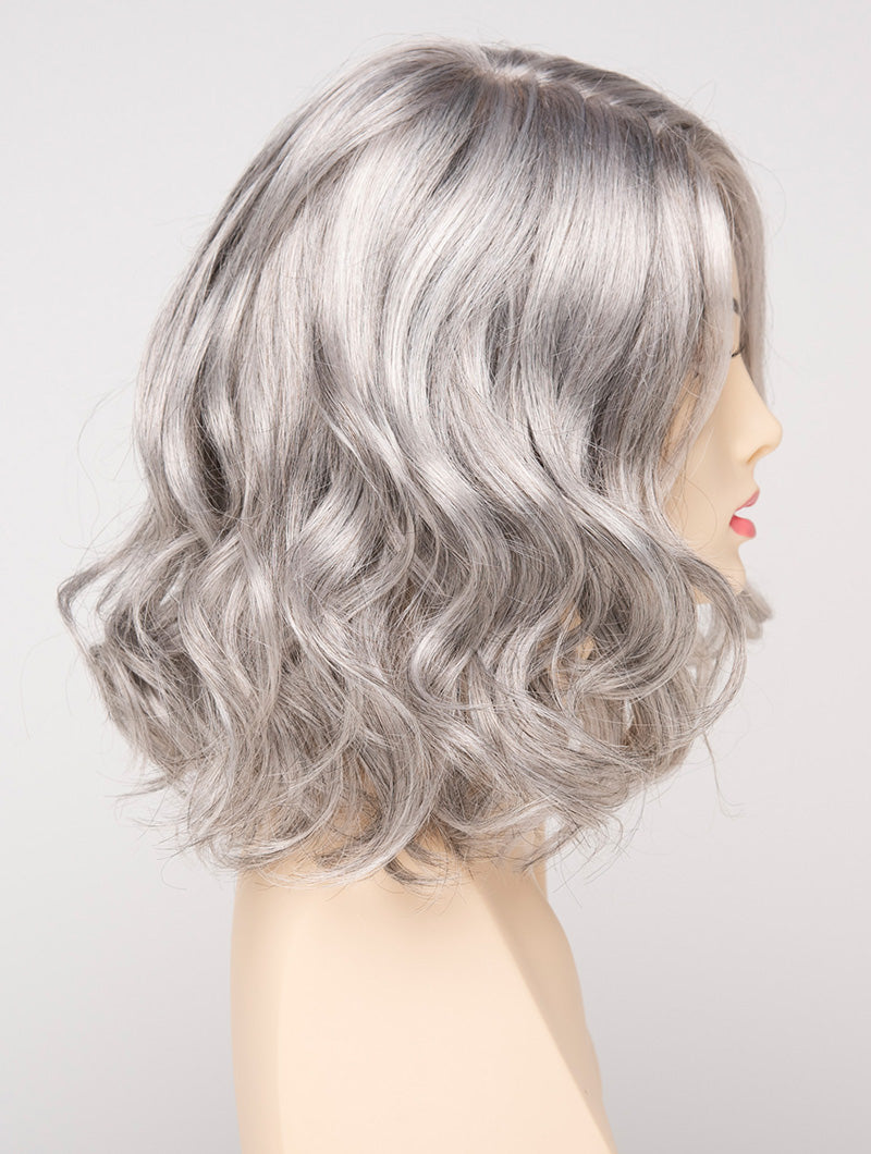 profile side of a medium Kinner Beauty Wigs wig for woman on mannequin head