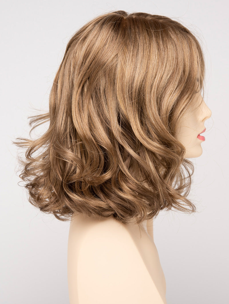profile side of a medium Kinner Beauty Wigs wig for woman on mannequin head