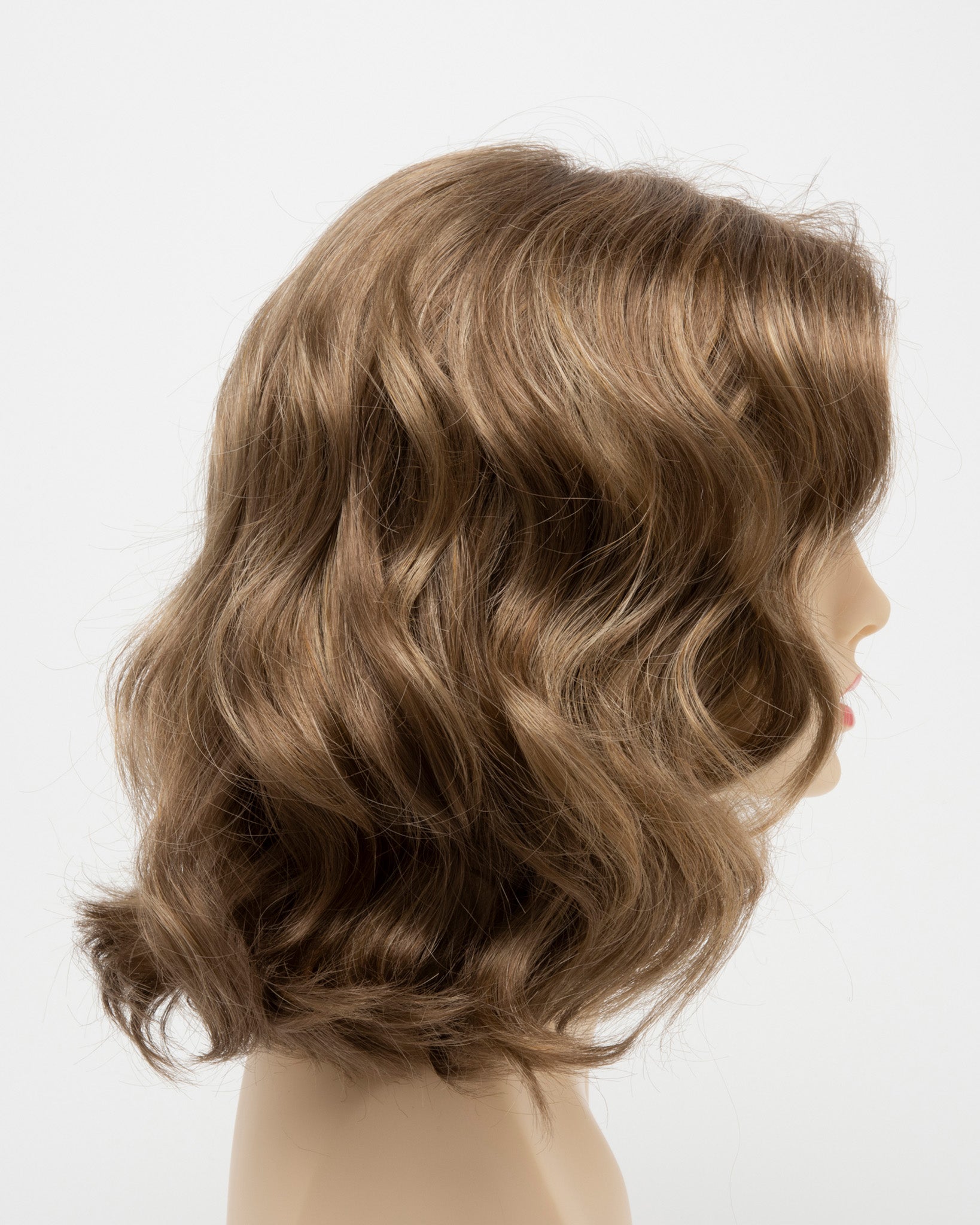 profile side of a medium Kinner Beauty Wigs wig for woman on mannequin head