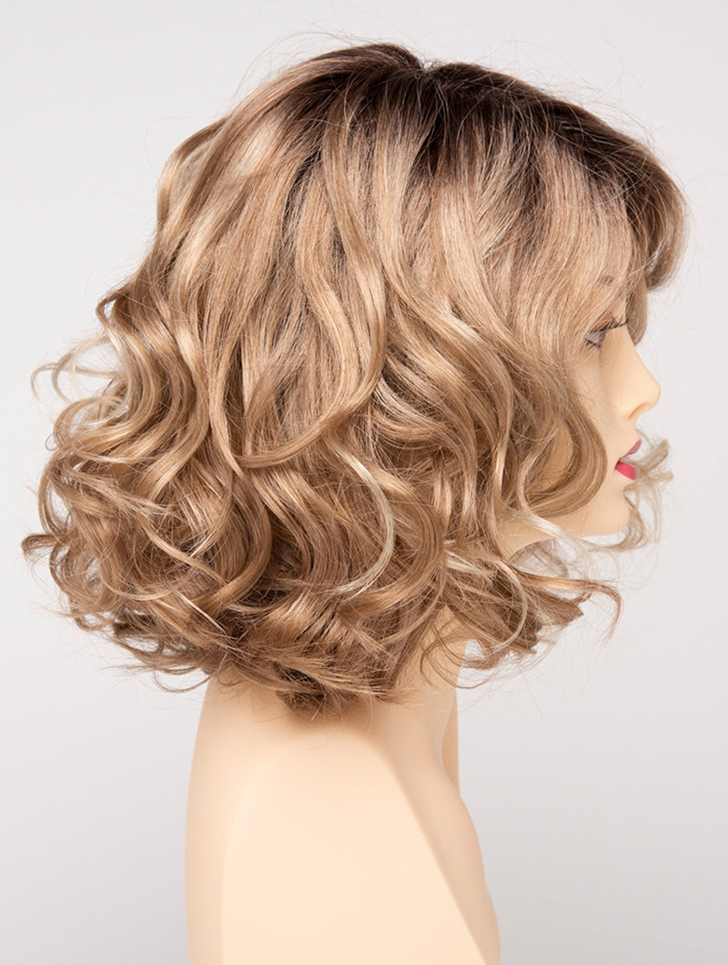 profile side of a medium Kinner Beauty Wigs wig for woman on mannequin head