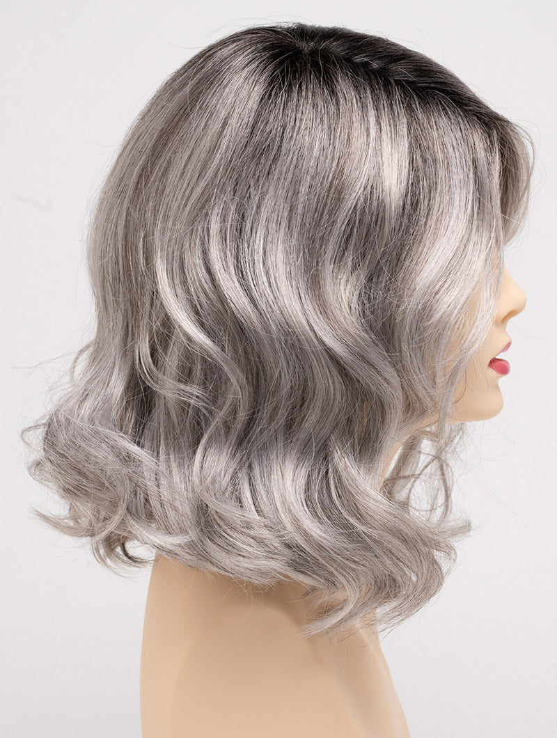profile side of a medium Kinner Beauty Wigs wig for woman on mannequin head