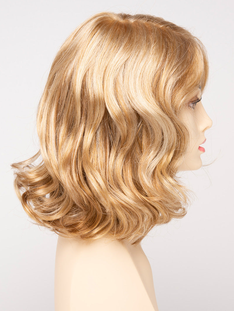 profile side of a medium Kinner Beauty Wigs wig for woman on mannequin head