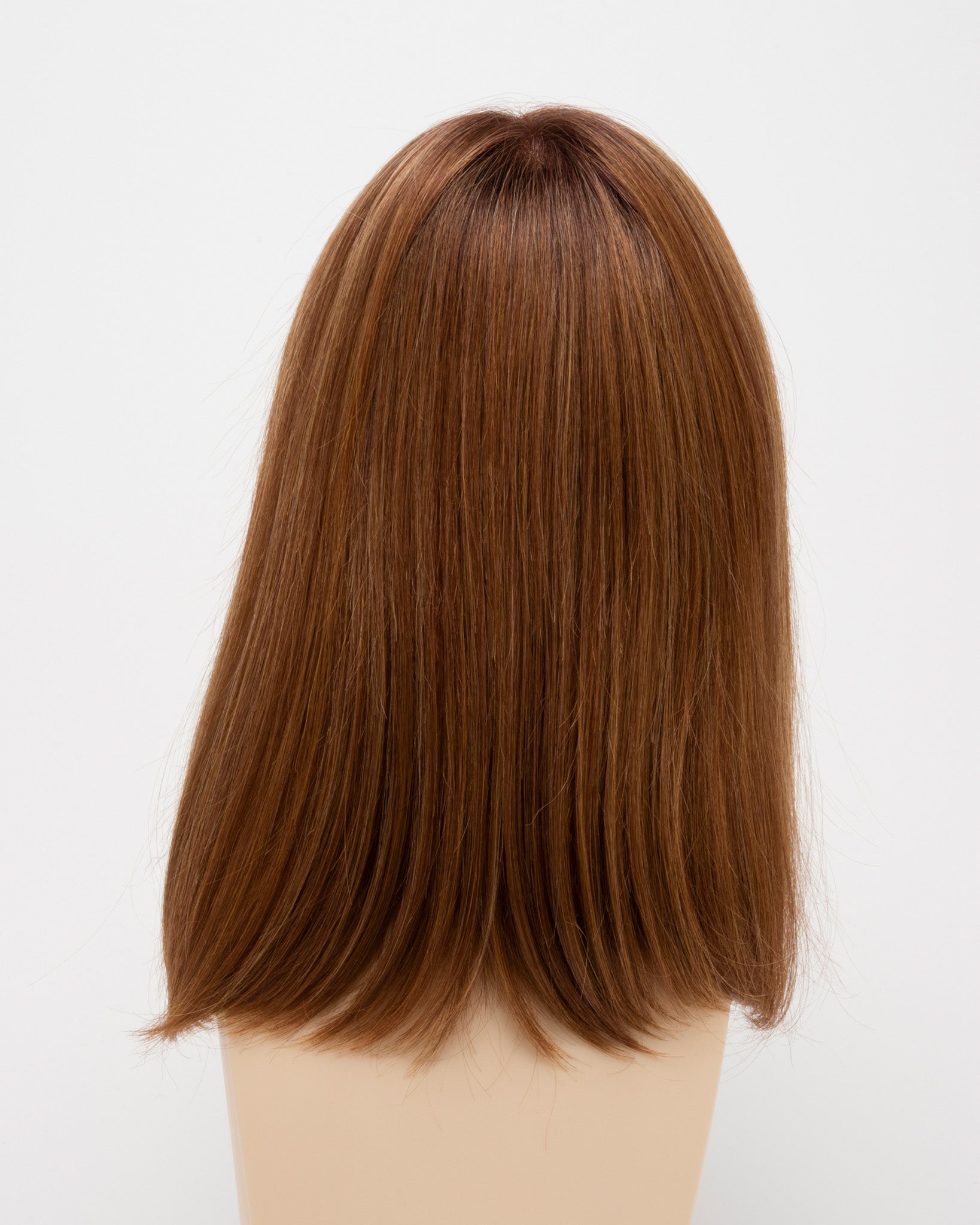 back side of a medium Kinner Beauty Wigs wig for woman on mannequin head