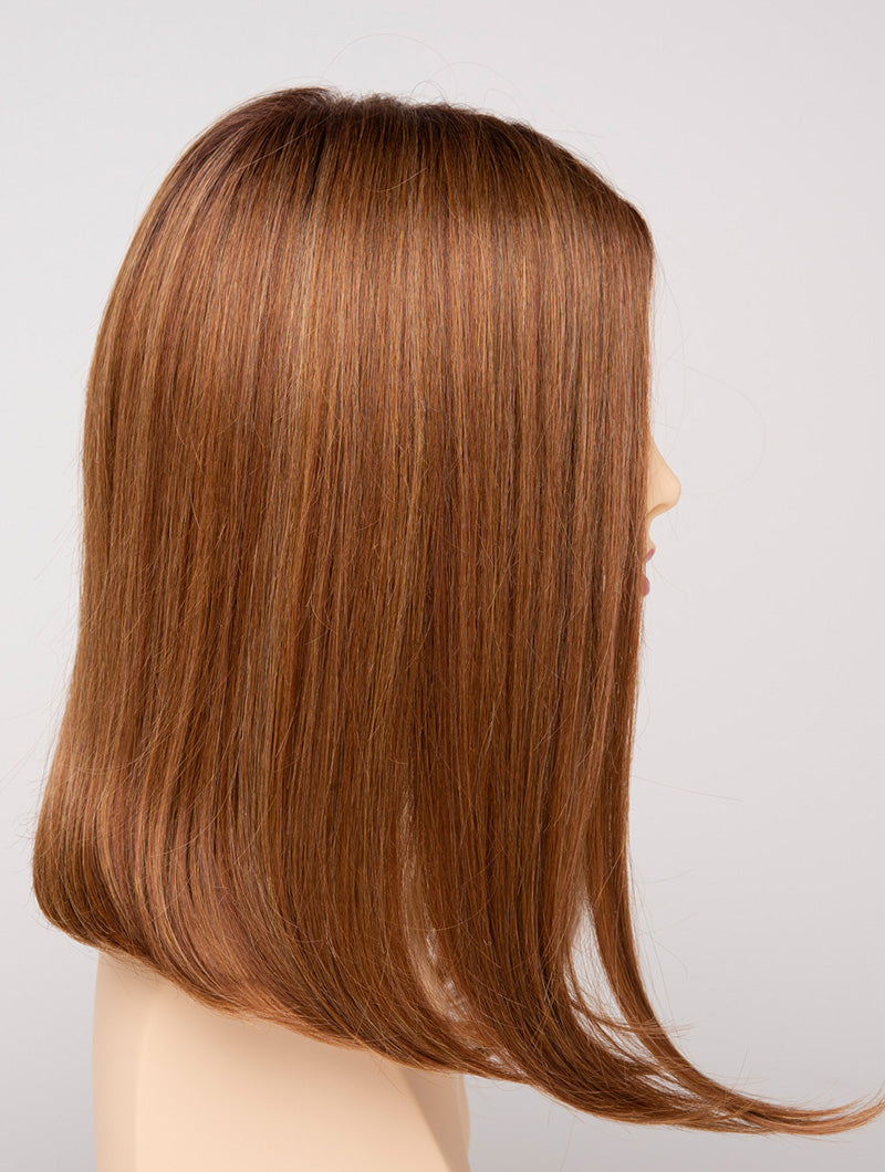 profile side of a medium Kinner Beauty Wigs wig for woman on mannequin head