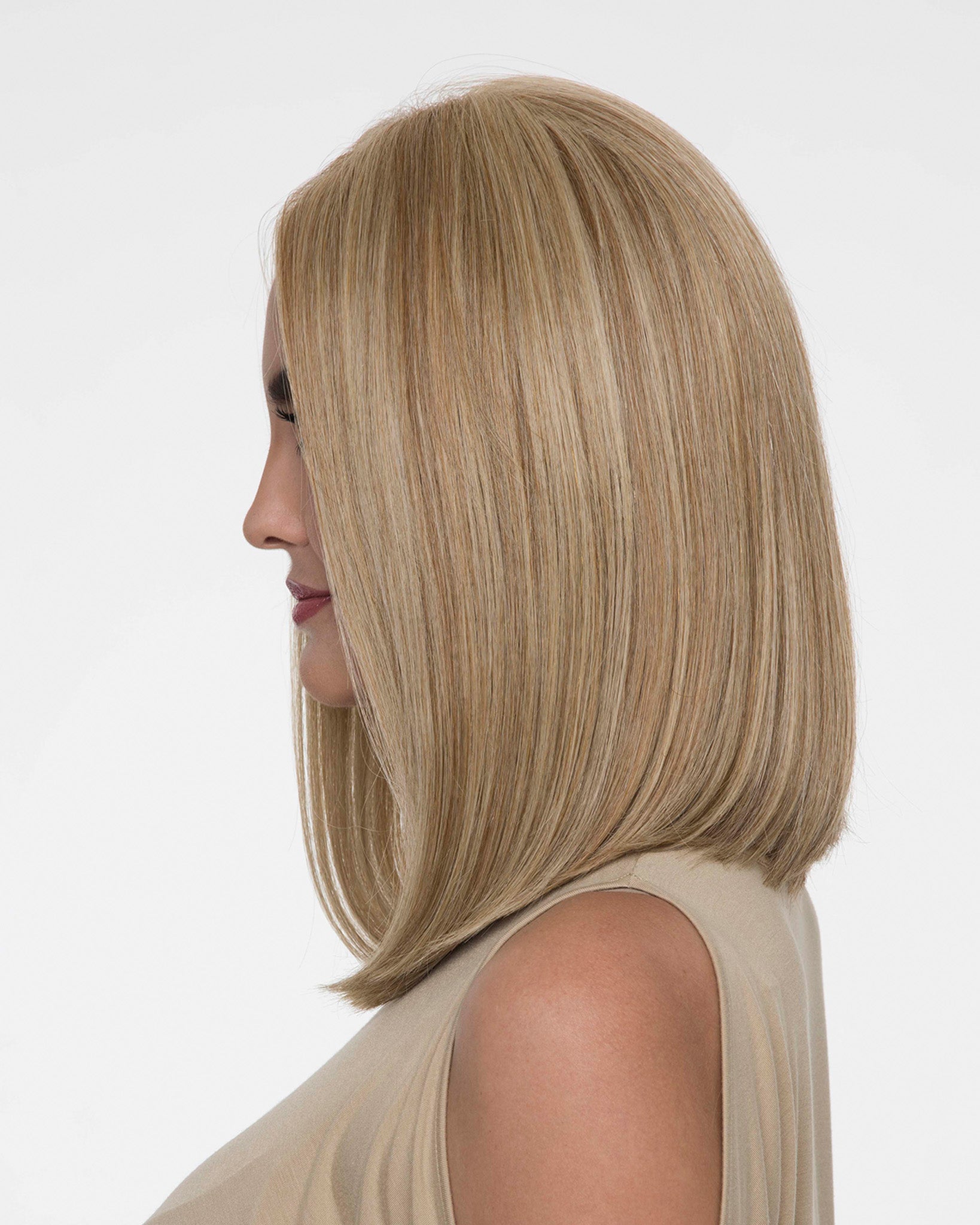 profile side of a medium Kinner Beauty Wigs wig on woman head