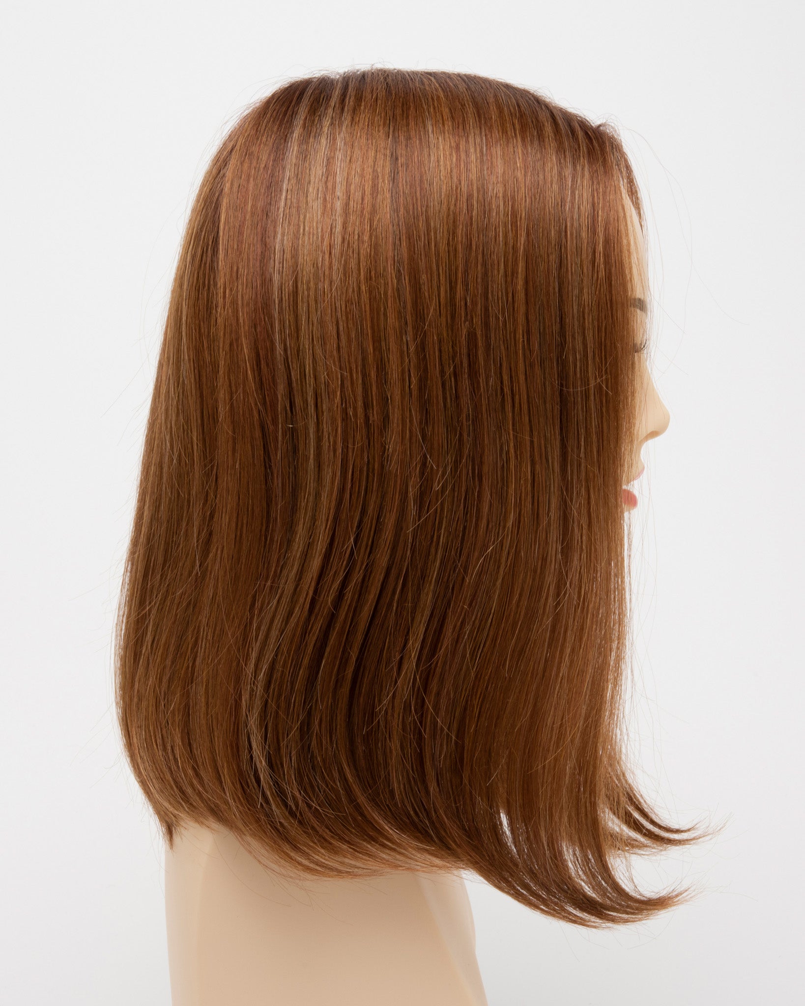 profile side of a medium Kinner Beauty Wigs wig for woman on mannequin head