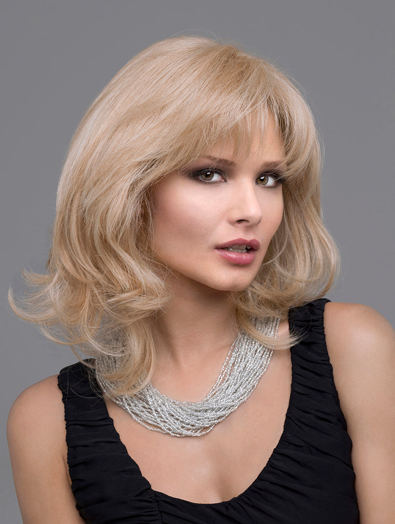front side of a medium Kinner Beauty Wigs wig on woman head