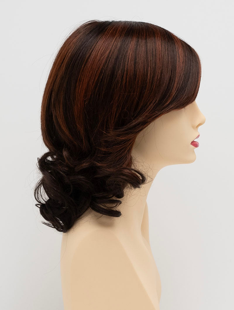 profile side of a medium Kinner Beauty Wigs wig for woman on mannequin head