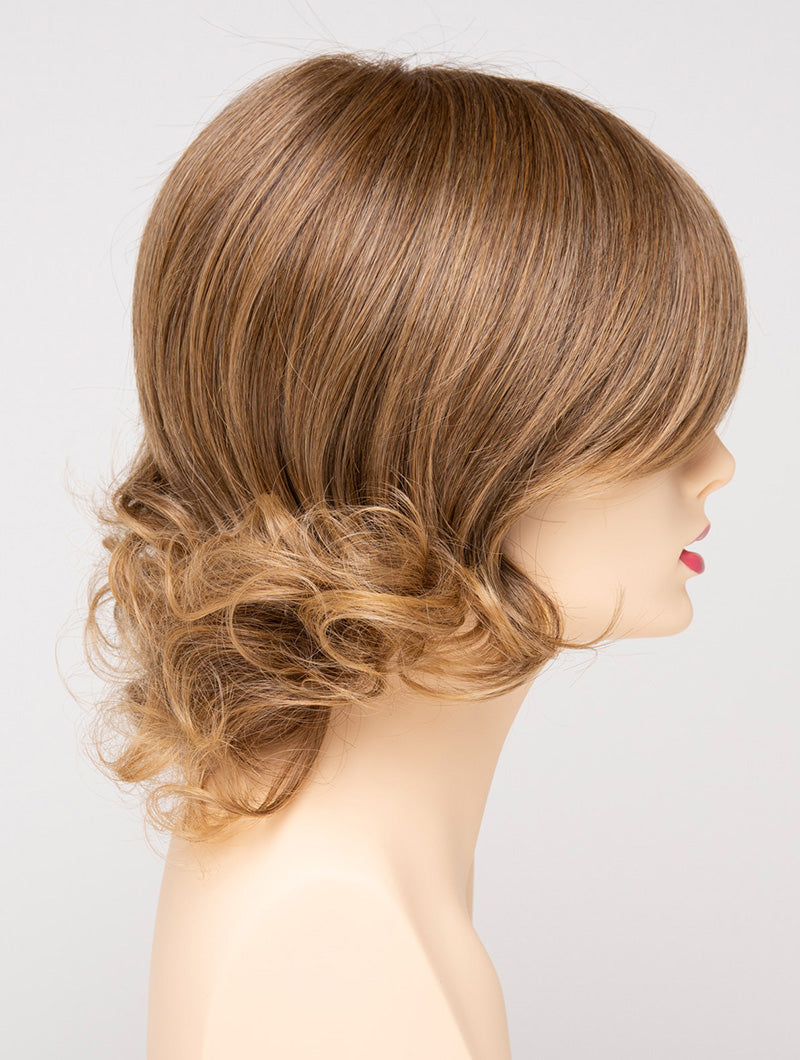 profile side of a medium Kinner Beauty Wigs wig for woman on mannequin head