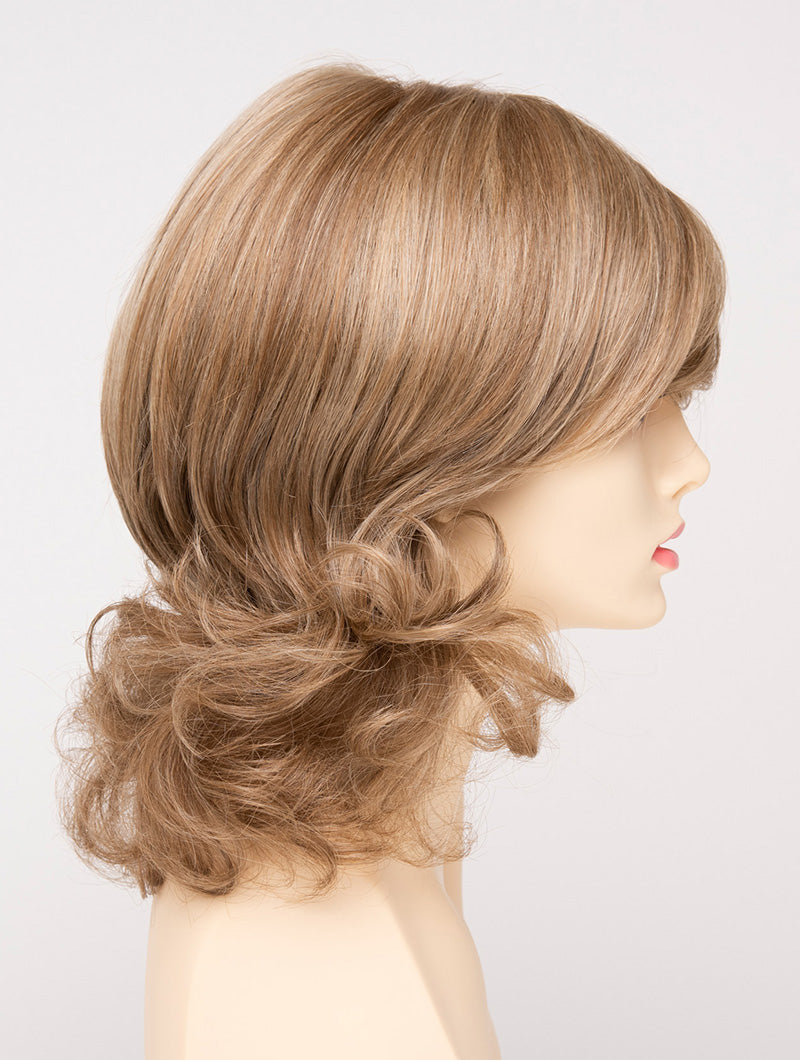 profile side of a medium Kinner Beauty Wigs wig for woman on mannequin head