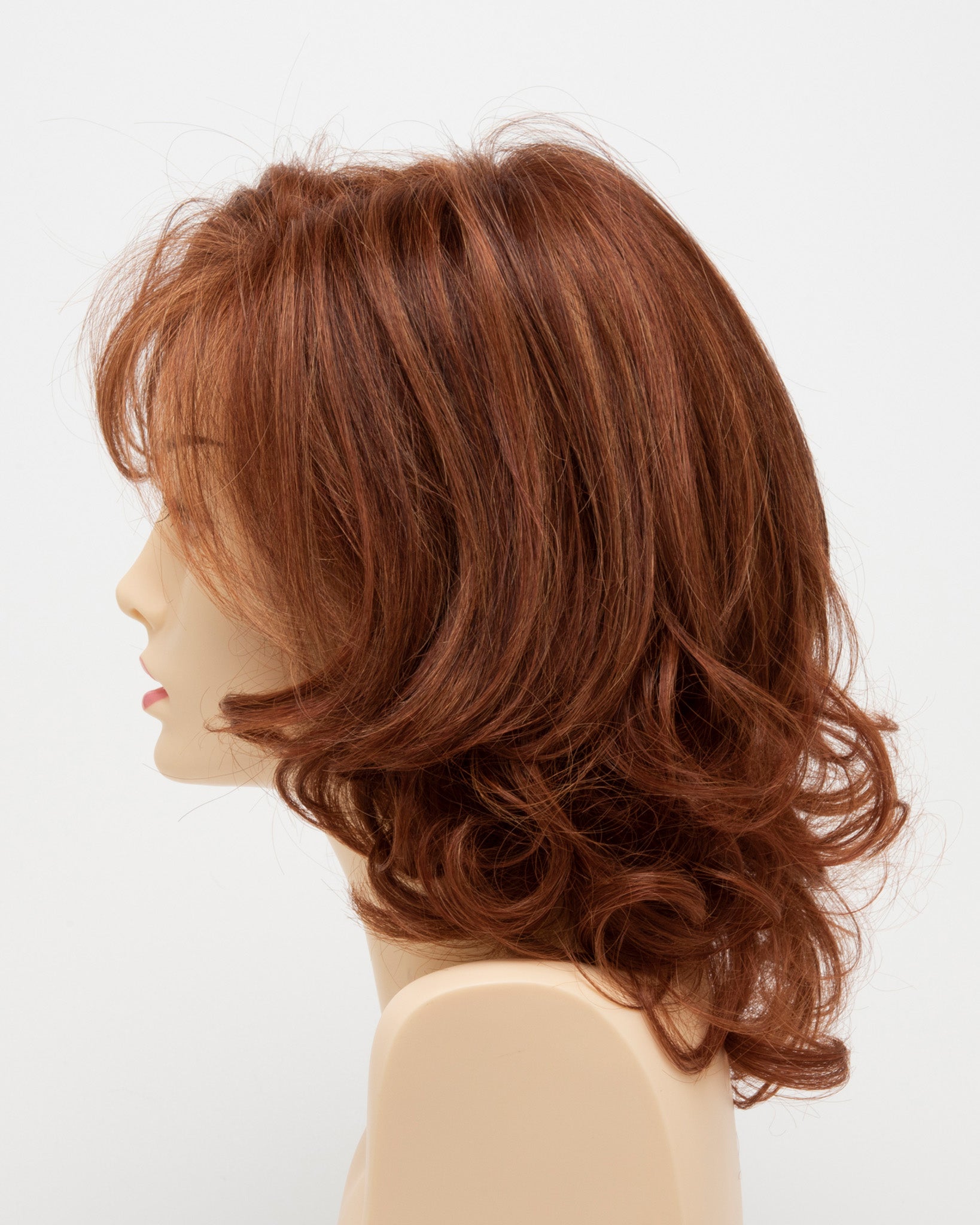 profile side of a medium Kinner Beauty Wigs wig for woman on mannequin head