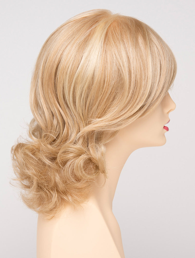 profile side of a medium Kinner Beauty Wigs wig for woman on mannequin head