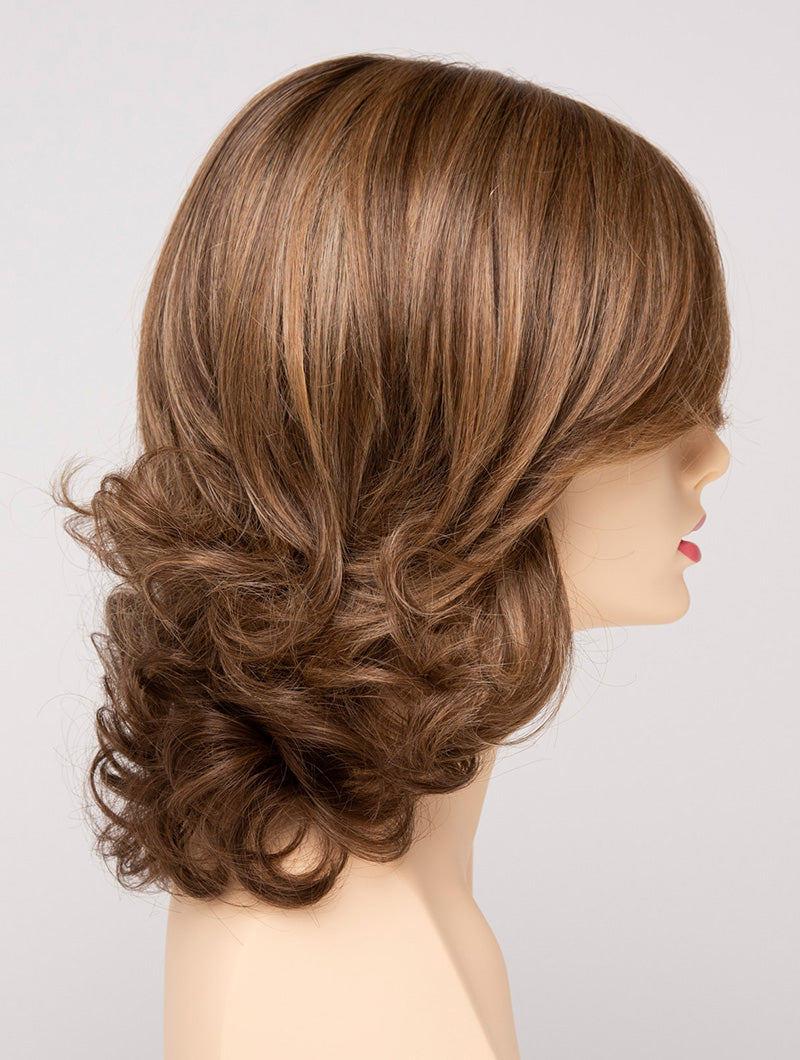 profile side of a medium Kinner Beauty Wigs wig for woman on mannequin head