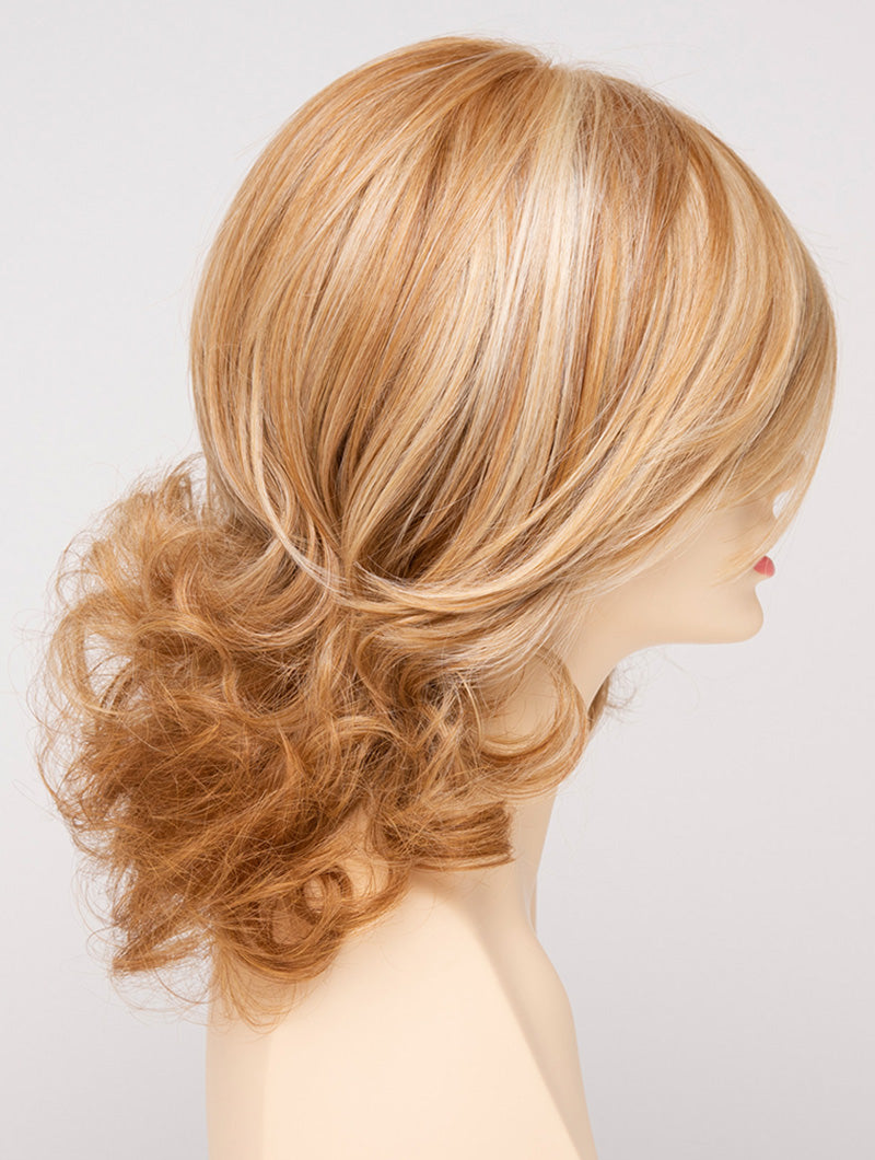 profile side of a medium Kinner Beauty Wigs wig for woman on mannequin head