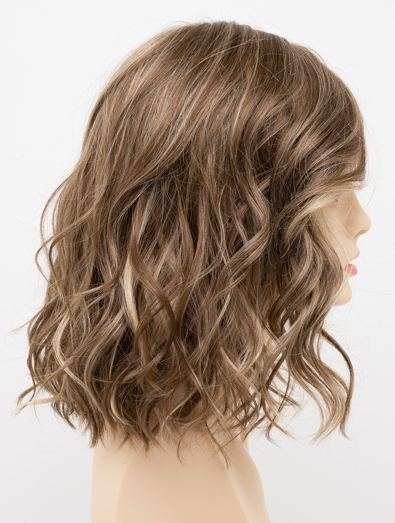 profile side of a medium Kinner Beauty Wigs wig for woman on mannequin head