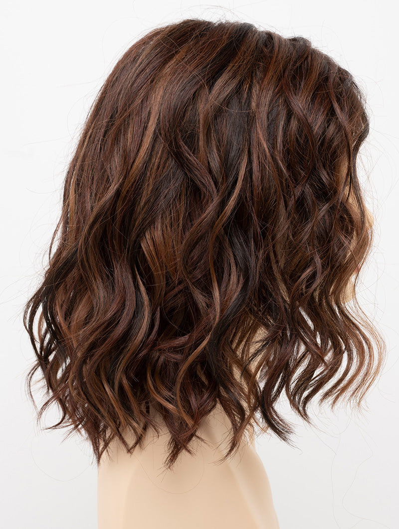 profile side of a medium Kinner Beauty Wigs wig for woman on mannequin head