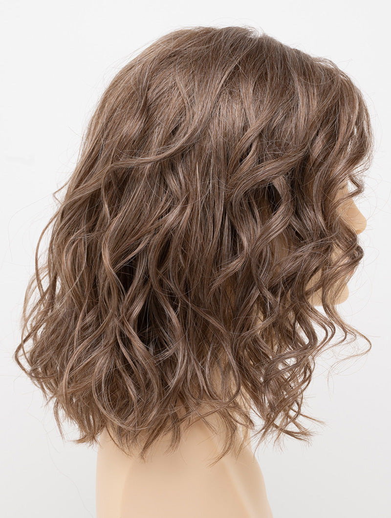 profile side of a medium Kinner Beauty Wigs wig for woman on mannequin head