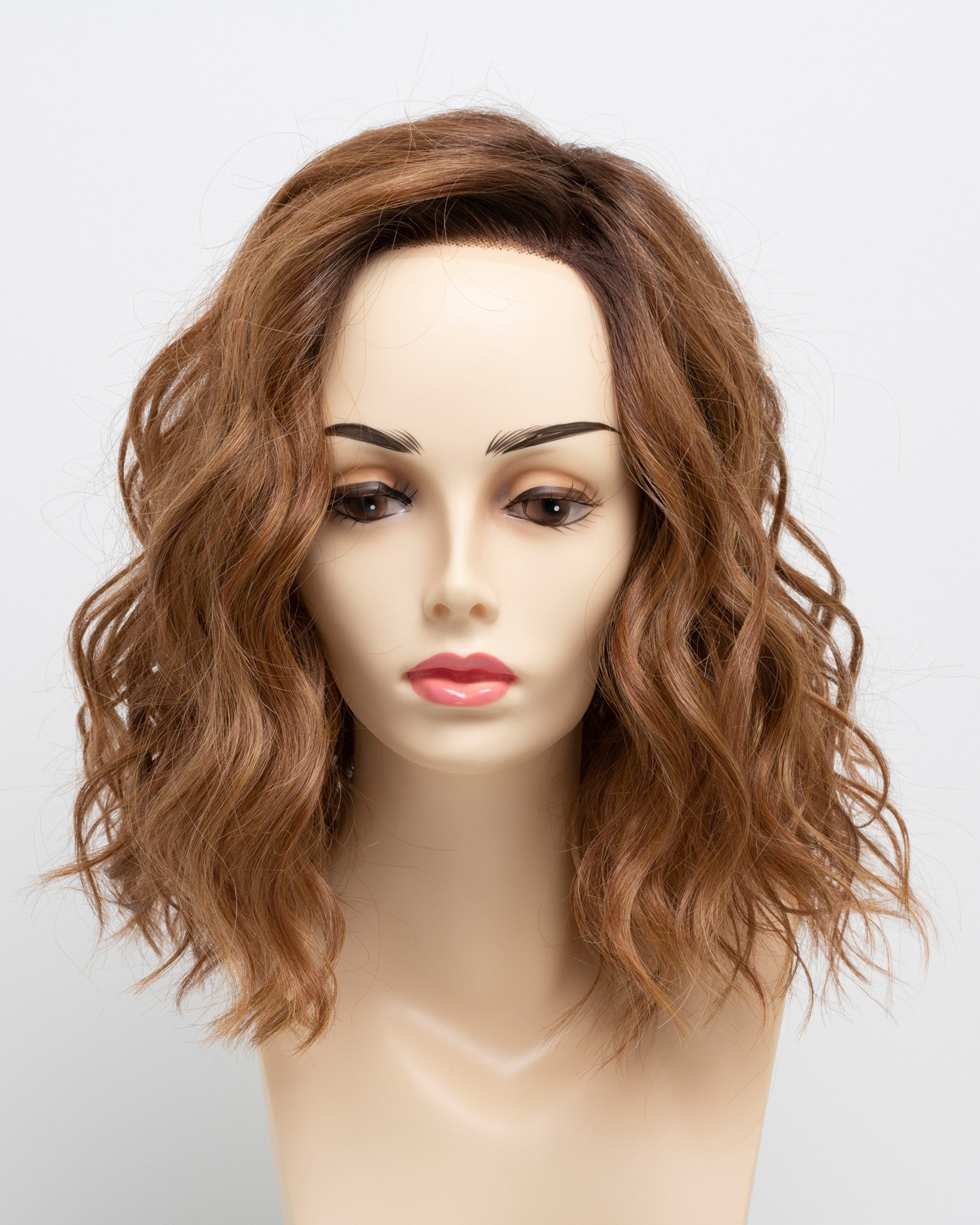 front side of a medium Kinner Beauty Wigs wig for woman on mannequin head