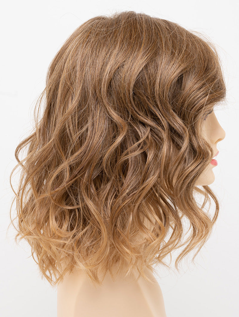 profile side of a medium Kinner Beauty Wigs wig for woman on mannequin head