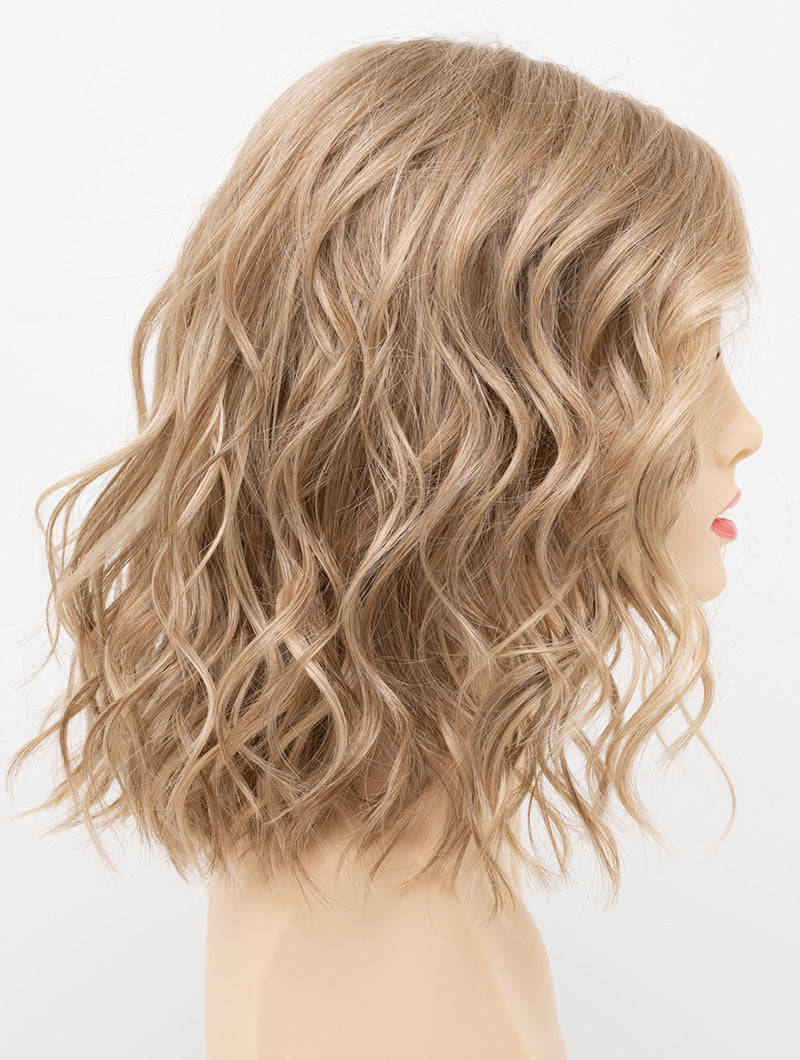profile side of a medium Kinner Beauty Wigs wig for woman on mannequin head