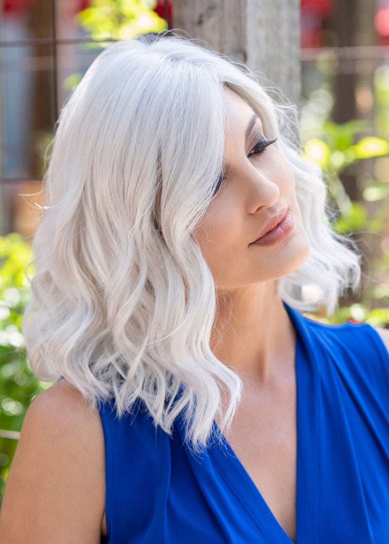 profile side of a medium Kinner Beauty Wigs wig on woman head
