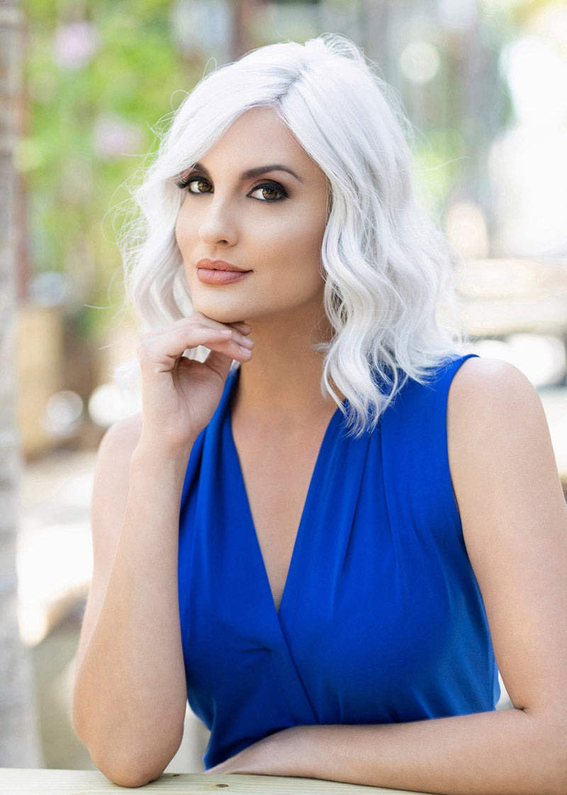front side of a medium Kinner Beauty Wigs wig on woman head