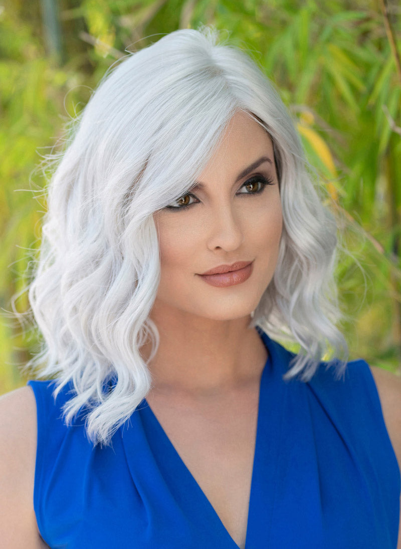 front side of a medium Kinner Beauty Wigs wig on woman head