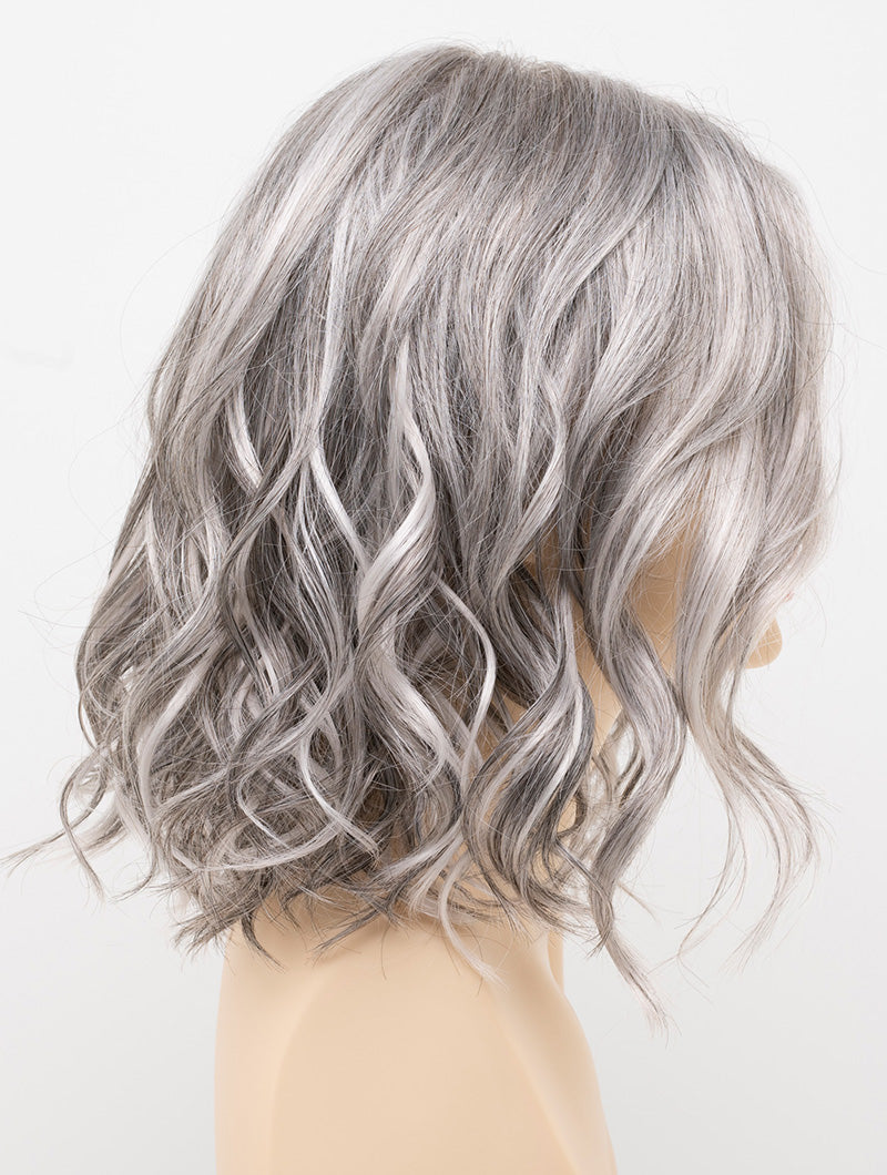 profile side of a medium Kinner Beauty Wigs wig for woman on mannequin head