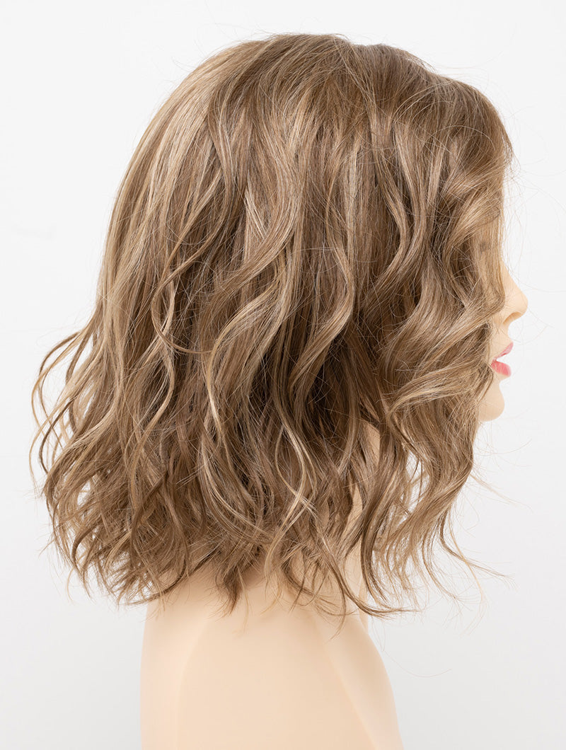 profile side of a medium Kinner Beauty Wigs wig for woman on mannequin head